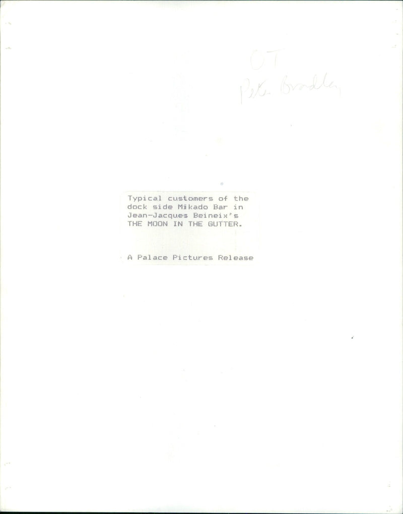 Two people are seen at a dockside bar in Jean-Jacques Beineix's movie "The Moon in the Gutter". - Vintage Photograph