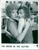 Two people are seen at a dockside bar in Jean-Jacques Beineix's movie "The Moon in the Gutter". - Vintage Photograph