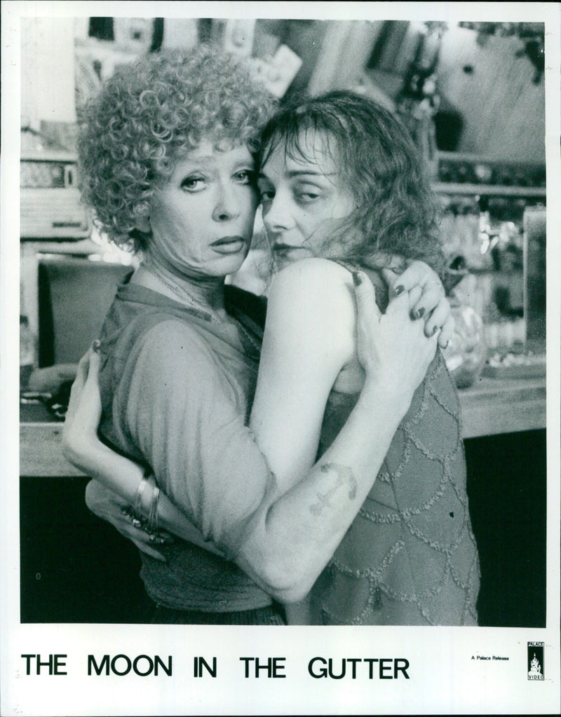 Two people are seen at a dockside bar in Jean-Jacques Beineix's movie "The Moon in the Gutter". - Vintage Photograph