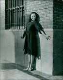 Actress Paulette Goddard poses in a scene from the 1936 film "Modern Times". - Vintage Photograph