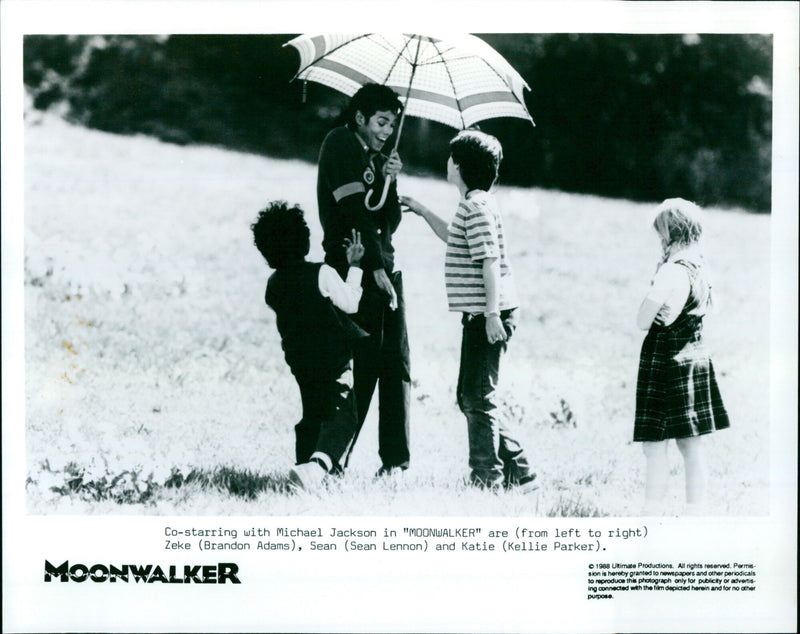 Michael Jackson co-stars with Brandon Adams, Sean Lennon, and Kellie Parker in the 1988 film "MOONWALKER." - Vintage Photograph