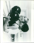 Members of the band Screwballs Timshils play at a concert in South Carolina. - Vintage Photograph