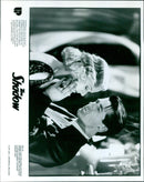 Lamont (ALEC BALDWIN) and Margo (PENELOPE ANN MILLER) discover a strange telepathic connection in the film "Shadow". - Vintage Photograph