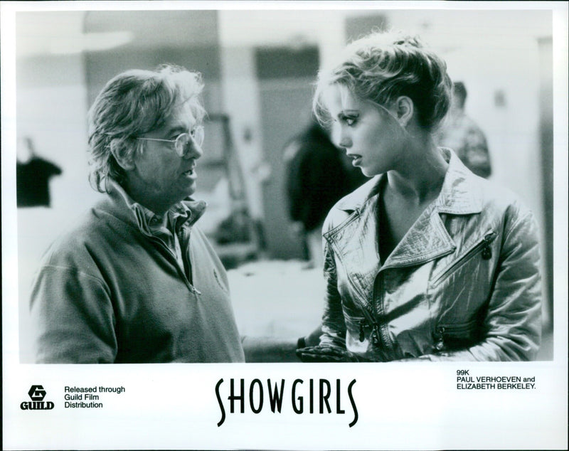 Actress Elizabeth Berkeley and director Paul Verhoeven attend the premiere of "Show Girls" in Los Angeles. - Vintage Photograph