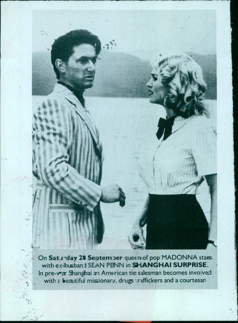 Sean Penn and Madonna attend the premiere of their new movie, Shanghai Surprise, in pre-war Shanghai. - Vintage Photograph