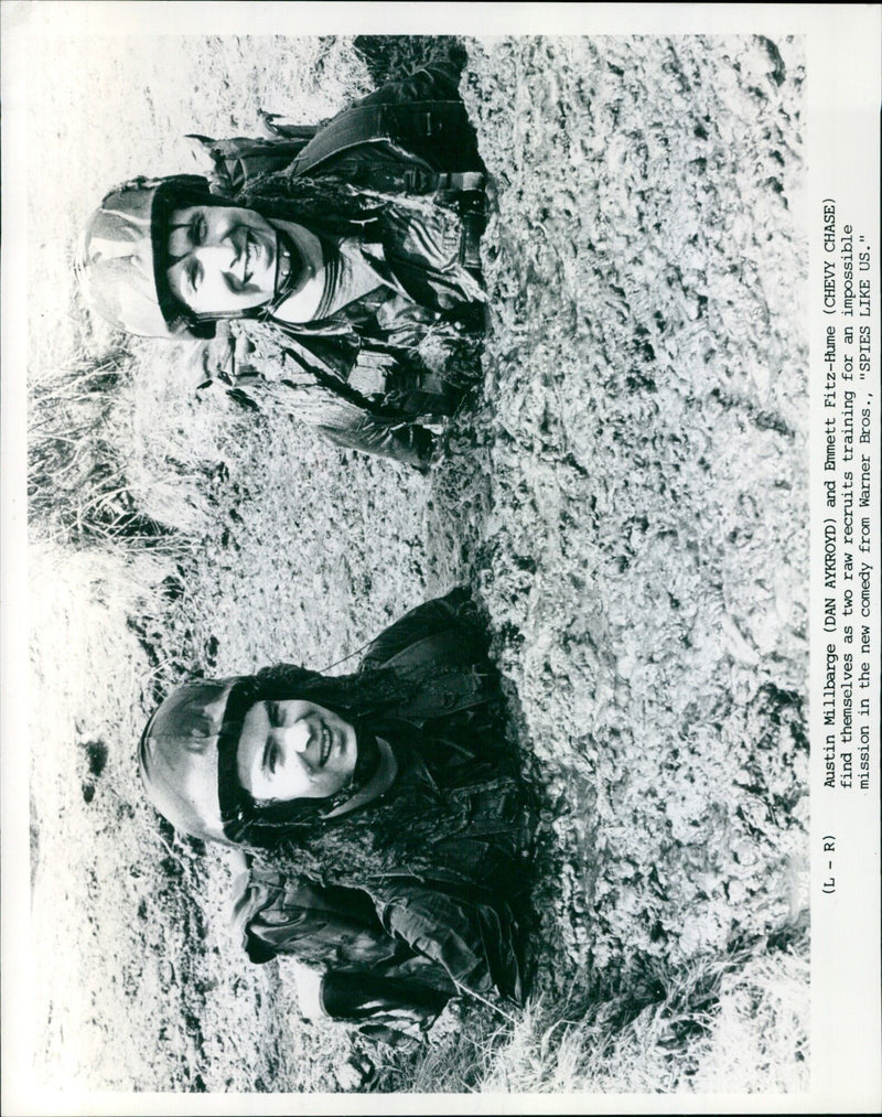 Actors Dan Aykroyd and Chevy Chase appear in a scene from the comedy film "Spies Like Us," released in 1986. - Vintage Photograph