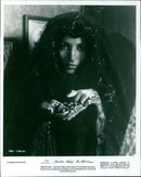 The Dust Witch (Pam Grier) from the movie "Something Wicked This Way Comes" dispatches a tarantula. - Vintage Photograph
