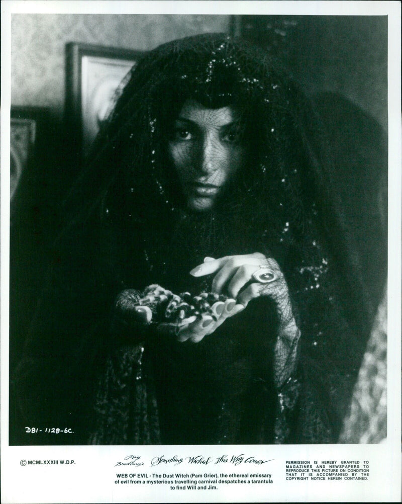 The Dust Witch (Pam Grier) from the movie "Something Wicked This Way Comes" dispatches a tarantula. - Vintage Photograph