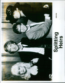 Prince Charles and Prince William sharing a laugh during a visit to Gloucester Cathedral. - Vintage Photograph