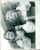 Two space travelers, a spacemon and King Arthur, in a futuristic landscape. - Vintage Photograph