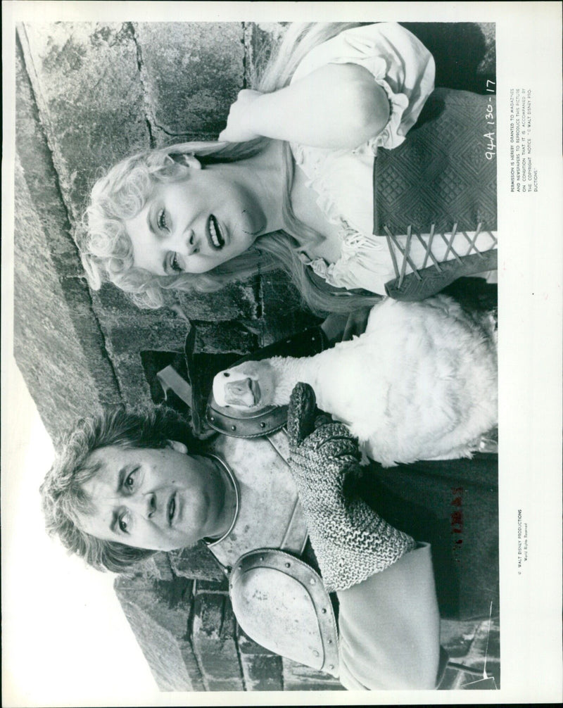 Two space travelers, a spacemon and King Arthur, in a futuristic landscape. - Vintage Photograph