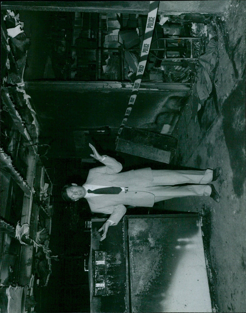 Co-owner of Microfilm Express surveying the damage from an arson attack in Thrupp Lane, Radley. - Vintage Photograph