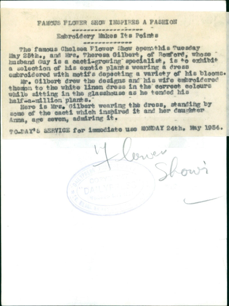 Mrs. Theresa Gilbert models a dress embroidered with motifs depicting cacti grown by her husband at the Chelsea Flower Show. - Vintage Photograph