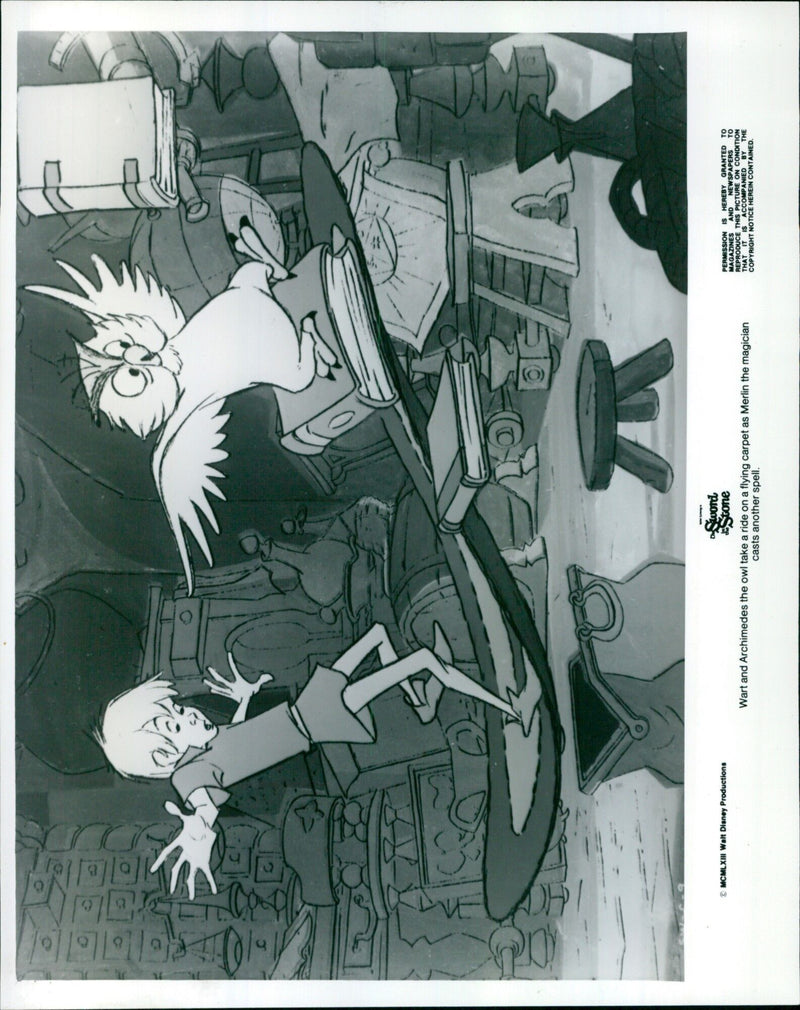 Walt Disney's Sword in the Stone characters, Wart and Archimedes, take a ride on a flying carpet. - Vintage Photograph