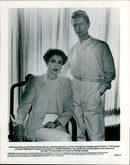 Catherine Deneuve and David Bowie in a scene from the 1983 film "The Hunger." - Vintage Photograph