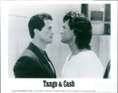 Sylvester Stallone and Kurt Russell star in the 1989 film 'Tango & Cash.' - Vintage Photograph