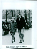 Mia Farrow and Liam Neeson are seen taking a walk in a scene from the movie "Husbands and Wives." - Vintage Photograph