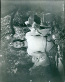 A crowd gathers in front of a movie theater in London, England. - Vintage Photograph