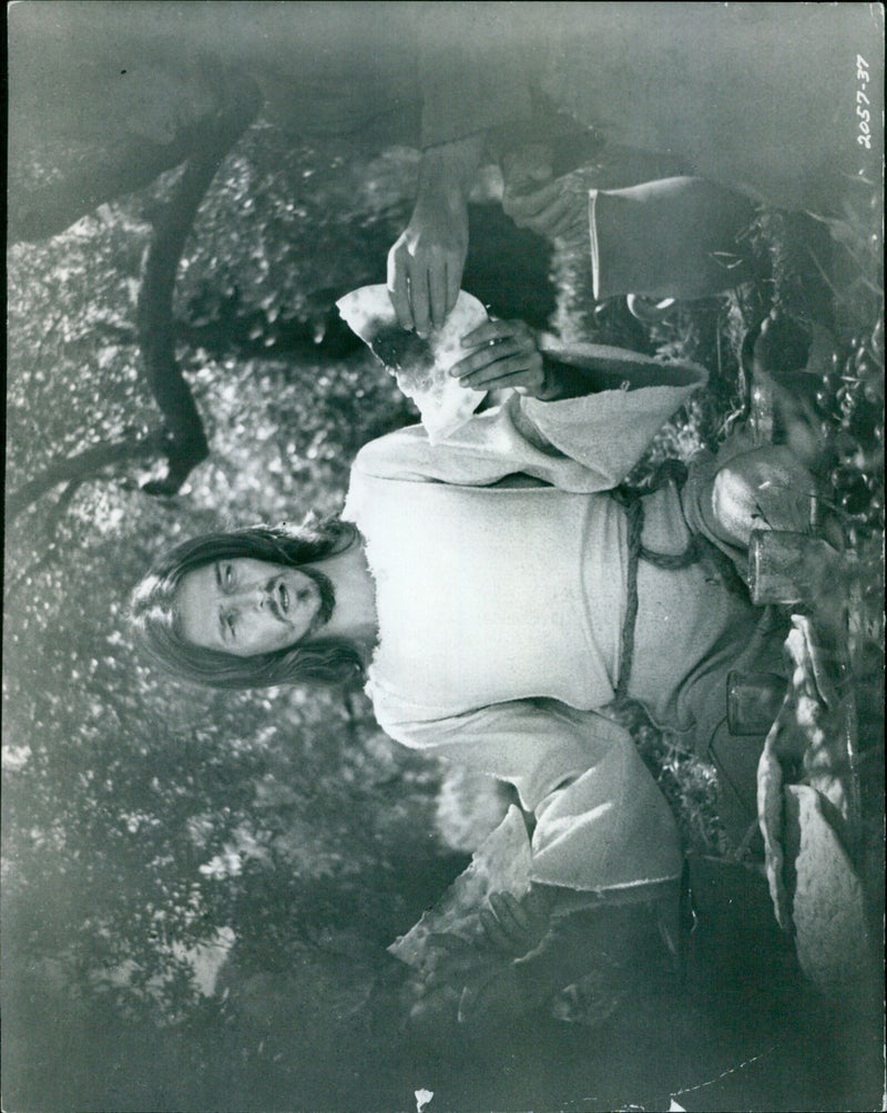 A crowd gathers in front of a movie theater in London, England. - Vintage Photograph