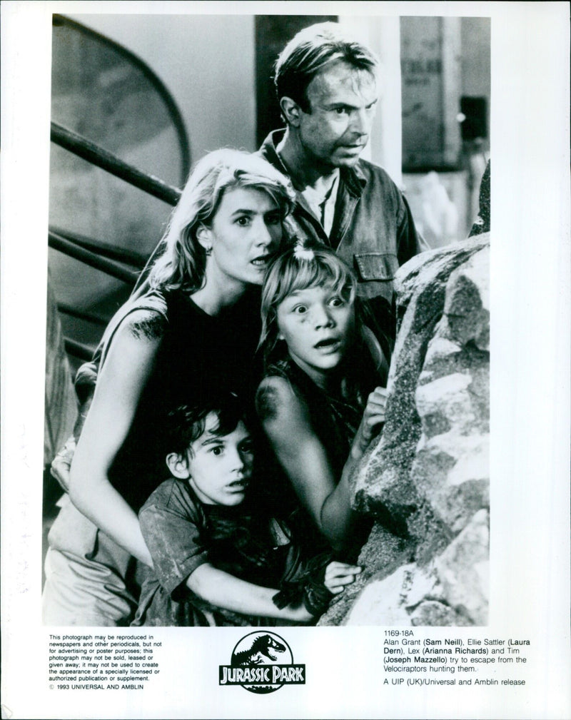 Sam Neill, Laura Dern, Arianna Richards, and Joseph Mazzello are seen in a scene from the 1993 Universal and Amblin film "Jurassic Park". - Vintage Photograph