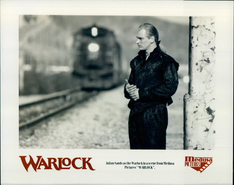 Actor Julian Sands stars as the Warlock in a scene from the movie "Warlock". - Vintage Photograph