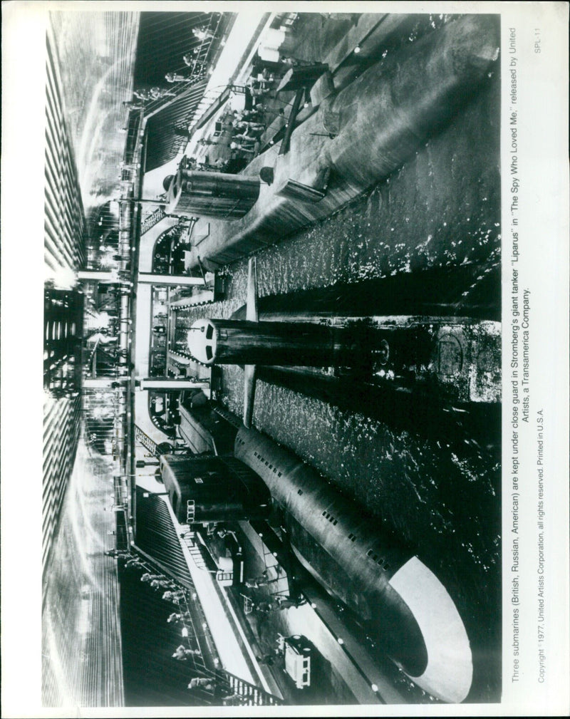 Three submarines from British, Russian and American naval fleets being guarded by the tanker Liparus in the film "The Spy Who Loved Me". - Vintage Photograph