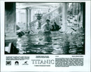 Jack (Leonardo DiCaprio) and Rose (Kate Winslet) are seen in a flooded first class reception area in the movie "Titanic." - Vintage Photograph