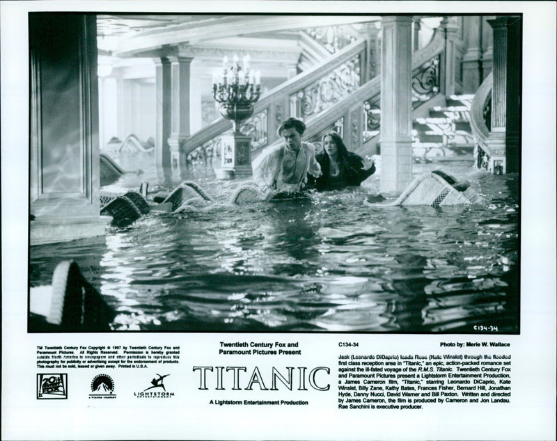 Jack (Leonardo DiCaprio) and Rose (Kate Winslet) are seen in a flooded first class reception area in the movie "Titanic." - Vintage Photograph