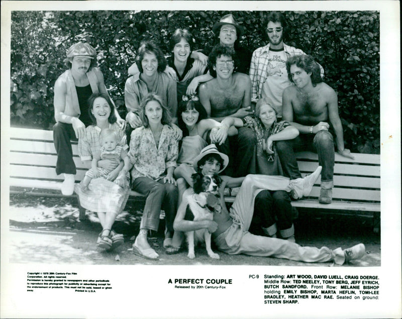A diverse cast of actors and actresses, young and old, pose for a publicity shot for the film "A Perfect Couple" on January 23, 1980. - Vintage Photograph