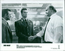 Arnold Schwarzenegger and Peter Boyle in a scene from the 1988 film "Red Heat". - Vintage Photograph