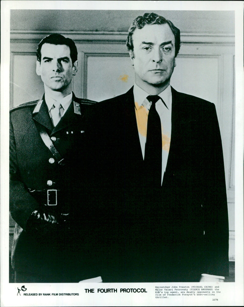 Michael Caine and Pierce Brosnan in a scene from the film "The Fourth Protocol." - Vintage Photograph