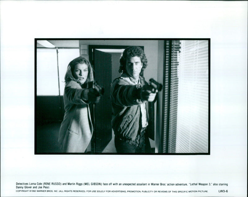 Detectives Lorna Cole and Martin Riggs face off with an unexpected assailant in "Lethal Weapon 3." - Vintage Photograph