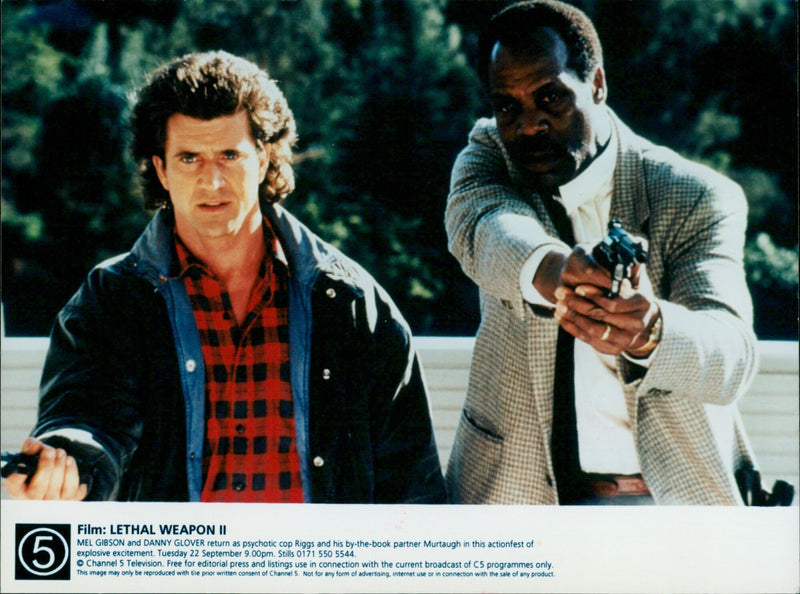 Mel Gibson and Danny Glover reprise their roles as Riggs and Murtaugh in the action film "Lethal Weapon II." - Vintage Photograph