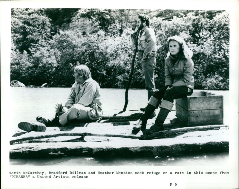Actors Kevin McCarthey, Bradford Dillman and Heather Menzies on a raft in a scene from the movie "Piranha". - Vintage Photograph