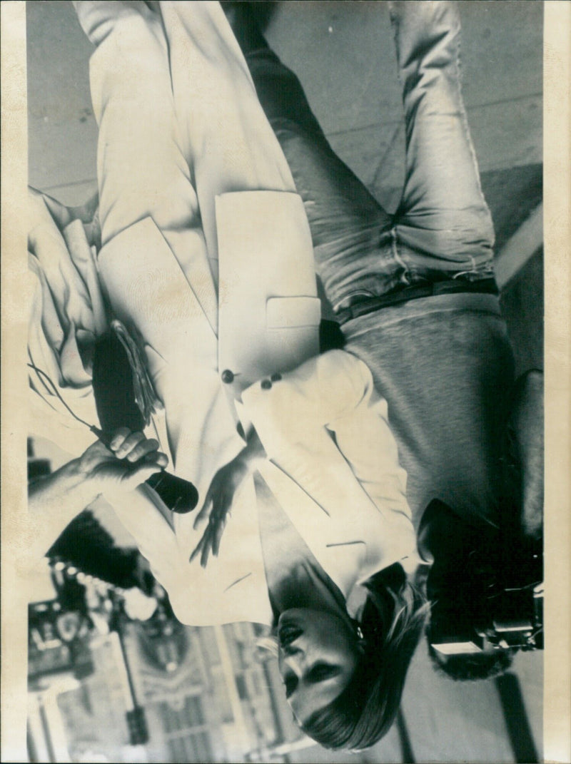Fashion models pose on a runway at a fashion show in Paris. - Vintage Photograph
