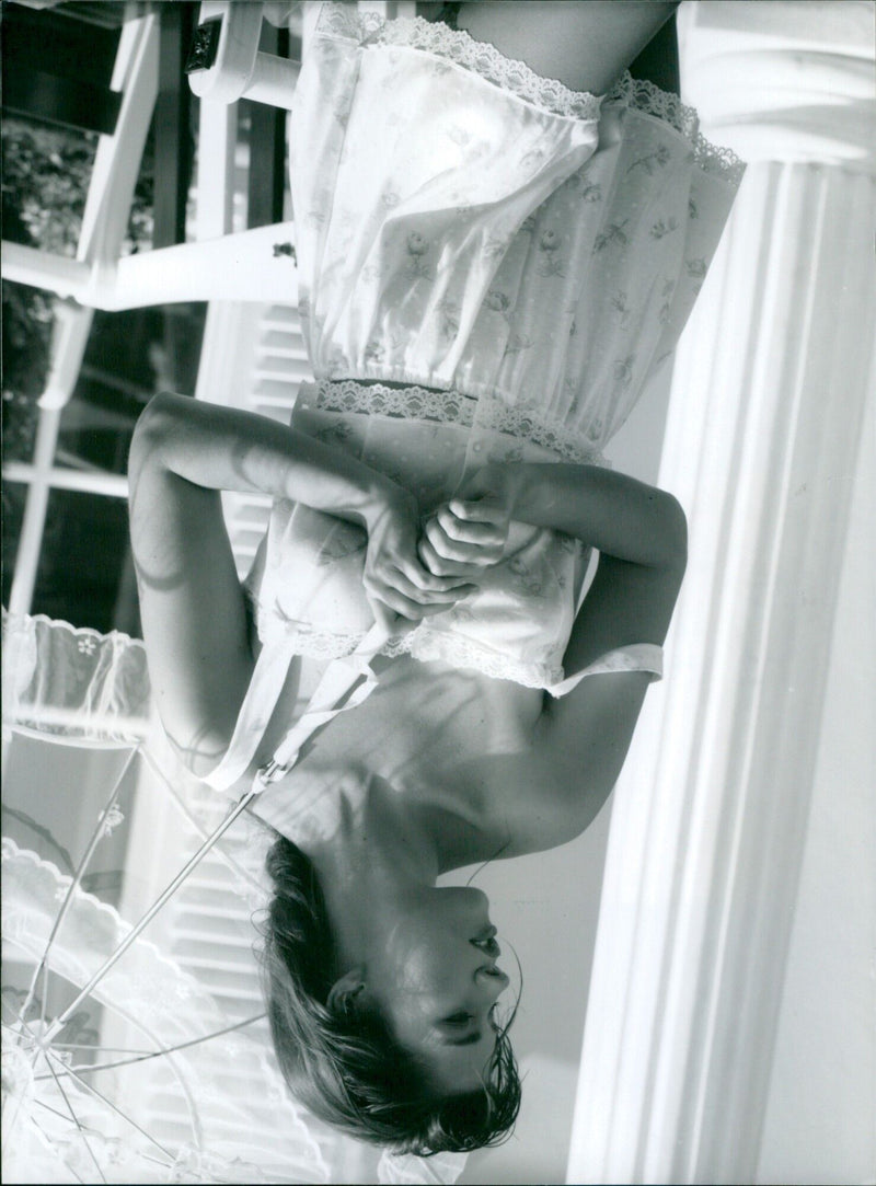 A model showcases the Bee Dees sleepwear from the Spring 1991 Night and Home Wear Collection by Triumph International. - Vintage Photograph