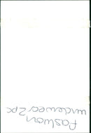 A model poses in a two-piece fashion underwear set. - Vintage Photograph