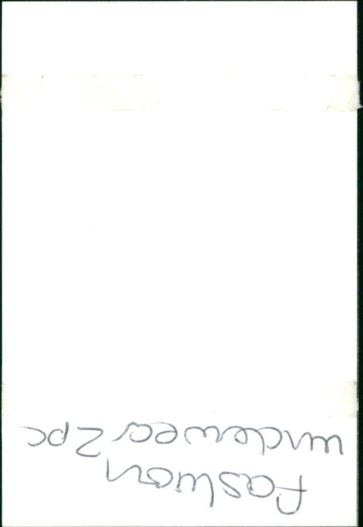 A model poses in a two-piece fashion underwear set. - Vintage Photograph