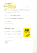 A model showcases a fashionable ensemble consisting of black denim dungarees and a copper sequin bra top. - Vintage Photograph