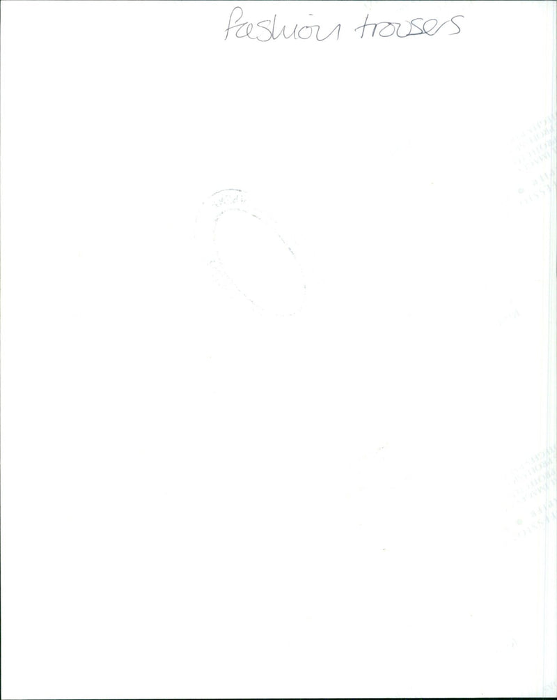 Model wearing stylish trousers walking on a catwalk. - Vintage Photograph