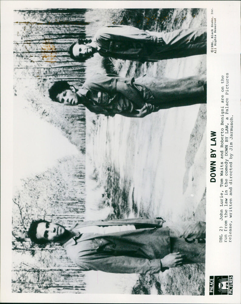 Actors John Lurie, Tom Waits, and Roberto Benigni running away from the law in the comedy film "Down By Law". - Vintage Photograph