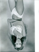 Models showcase the latest line of TASH-Underwear in a vivid underwater photoshoot. - Vintage Photograph