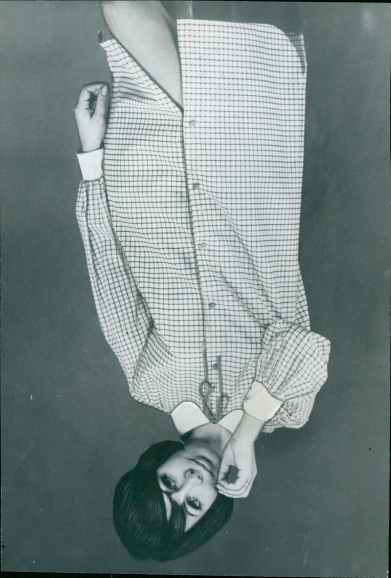 A man models a fashionable cotton checked shirt with an Eton collar and cuffs in white. - Vintage Photograph