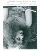Actress Carol Kane attends a party at Long's Tavern in the film "Valentino." - Vintage Photograph