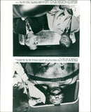 Robert Mitchum and Leslie Nielsen in a scene from the 1979 film "The Amsterdam Kill". - Vintage Photograph