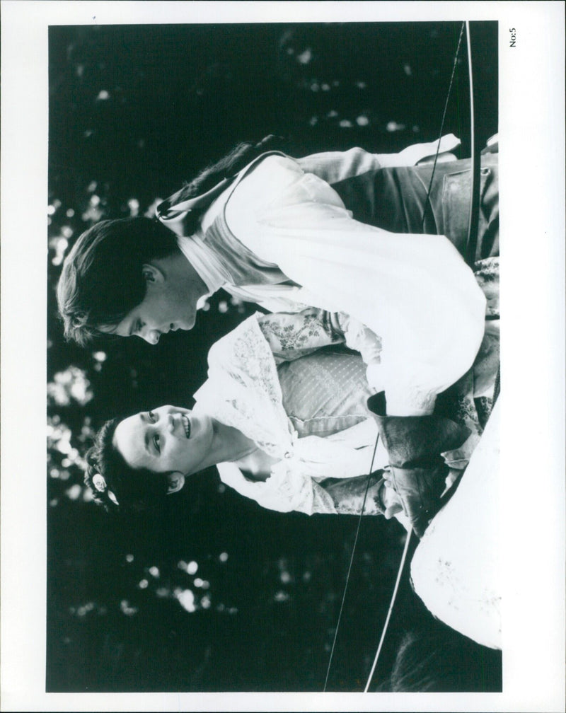 Meg Tilly and Colin Firth on the set of the film "Valmont." - Vintage Photograph