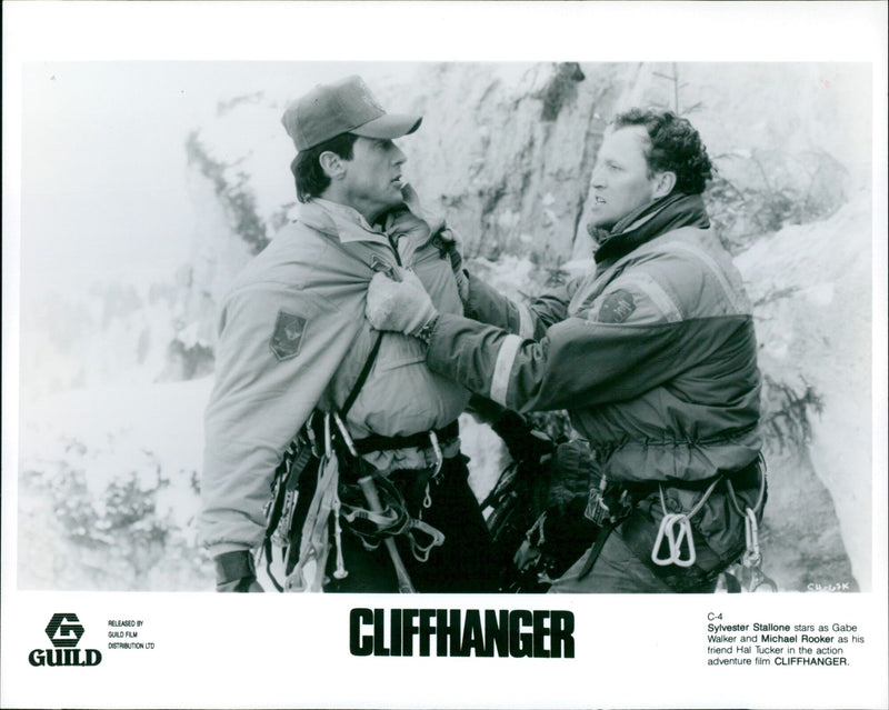 Sylvester Stallone and Michael Rooker star in the 1993 action adventure film "Cliffhanger". - Vintage Photograph