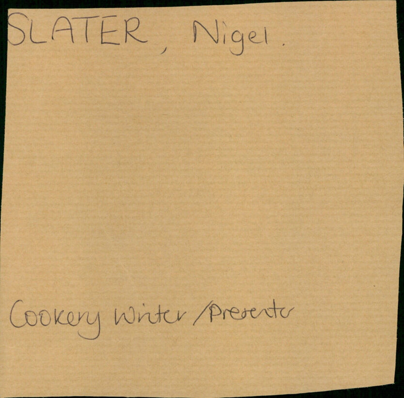Nigel Slater, a cookery writer and presenter, demonstrating a recipe in his kitchen. - Vintage Photograph
