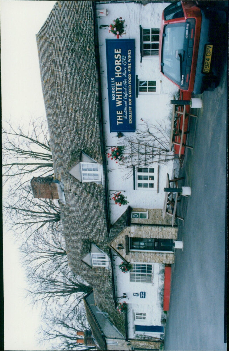 A traditional pub called The White Horse, located in Forest Hill, is seen with its sign and Volvo 0924 CPV 480 ES parked outside. - Vintage Photograph