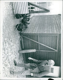 Gopal, a 4-year-old elephant, enjoys playing in the water at the Tuesday River in Karnataka, India. - Vintage Photograph